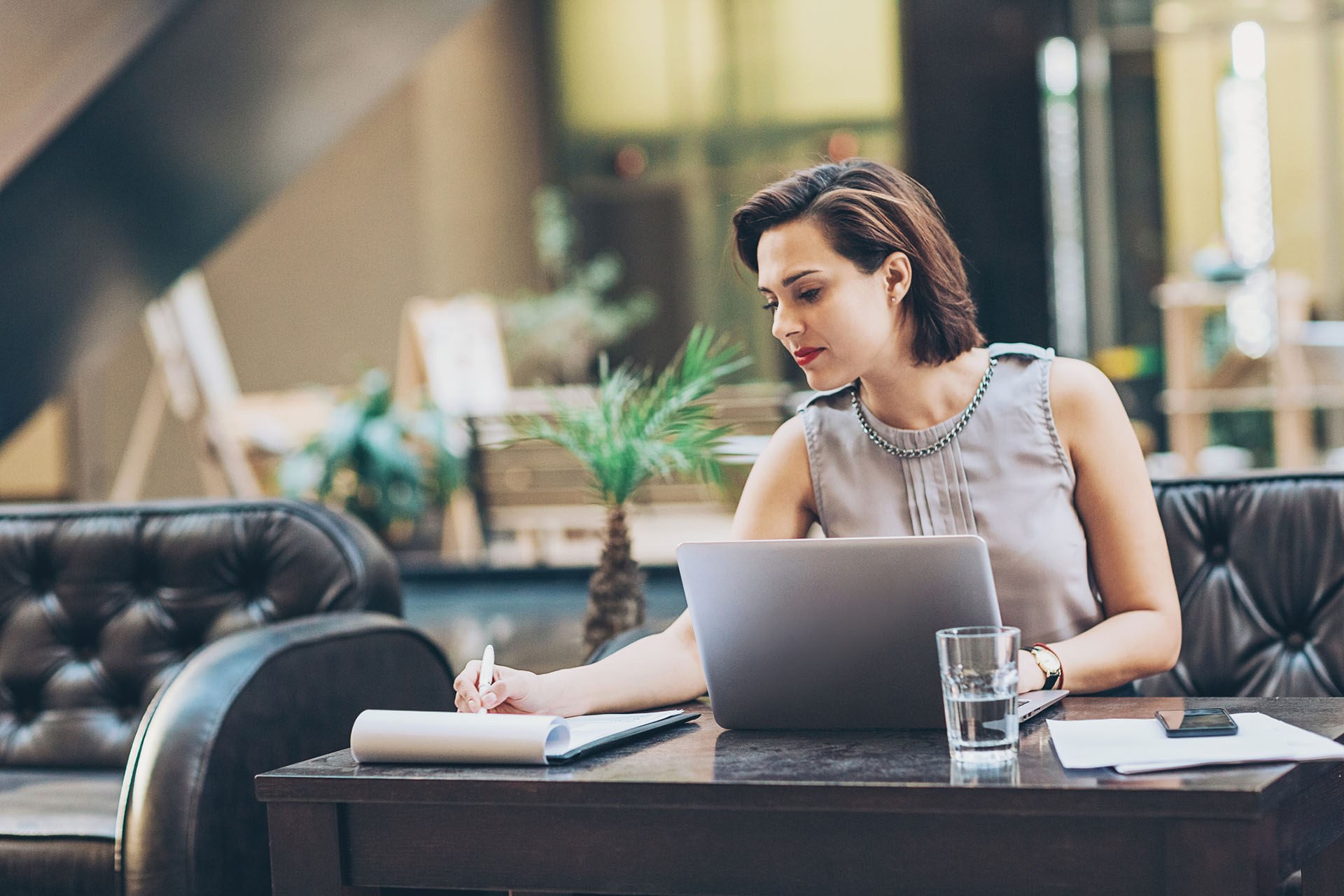 Woman in front of laptop engaged in virtual mediation